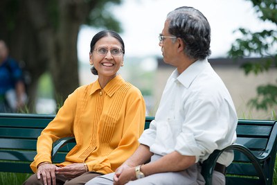 Faculty sitting on bench